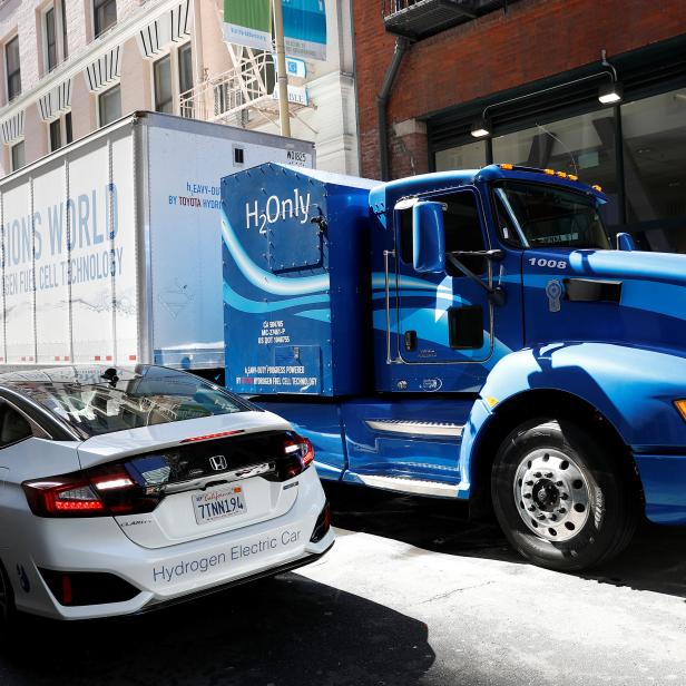A Toyota Project Portal hydrogen fuel cell electric semi-truck and a Honda Clarity hydrogen fuel cell vehicle are shown during an event in San Francisco, California